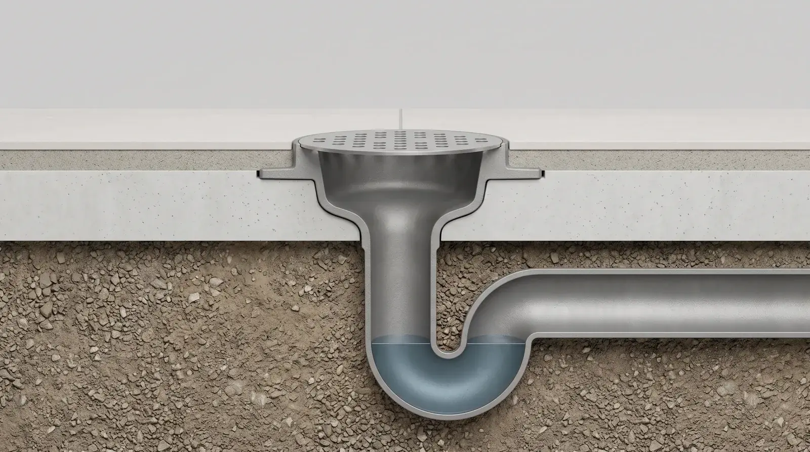 Cross-section of a floor drain P-trap holding a water seal